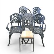 Cast-iron Ivy table set to include hand detailed scrollwork table, and four matching chairs with