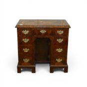 Edwardian style walnut kneehole desk, with central floral marquetry inlay top & decorative brass