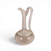 A Victorian Crystal Glass Claret Jug with detailed pattered etching. H:-24cm