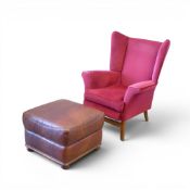 Parker Knoll wing back chair, model number 757, upholstered in red fabric with wooden legs, together
