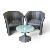 Frosted glass round coffee table on ribbed cast iron pedestal base, together with two black faux