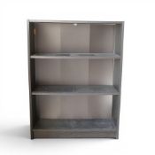 A pair of Ikea Billy bookcases with three adjustable shelves, in a black finish. (H: 106cm x W: 80cm