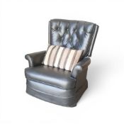 Black leather recliner chair featuring button-tufting on the backrest. COURIER OR COLLECTION ONLY