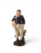 A Royal Doulton figure, early version of Fat boy HN 555, with Black Coat, height 18cm. small area of