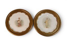 Two early 20th century decorative plates in surrounds , one featuring a Female with Milking stool