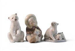 A group of three Lladro figures to include Eskimo playing model 1195, Resting Polar Bear 1208 &