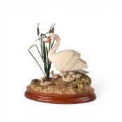 A Border Fine Arts Model, 'First One', on a wooden plinth, with a Swan and Cygnets. height 23cm,