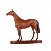 Beswick Connoisseur Race Horse 'Red Rum' on wooden plinth.