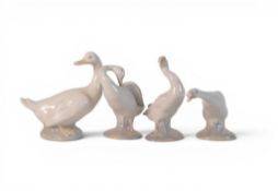 A group of four lladro geese, tallest height 12cm, One with chip to beak(4)