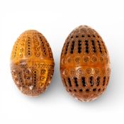 Two Antique carved coquilla nut pomanders, largest L.7.5cm. (2)