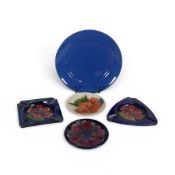 Moorcroft, two coasters in the Anemone and Coral Hibiscus patterns, two ashtrays in the in Crimson