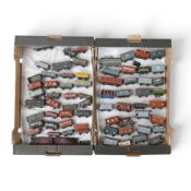 A collection of mainly loose metal OO gauge freight wagons and vans from various manufacturers, in