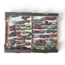 A collection of mainly loose metal OO gauge freight wagons and vans from various manufacturers, in