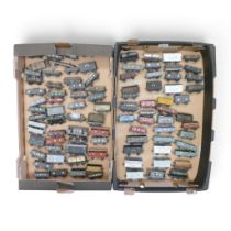 A large quantity of OO gauge goods vans, wagons and tankers from various manufacturers, featuring