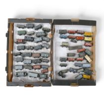 A collection of mainly loose metal OO gauge freight wagons and vans from various manufacturers, in