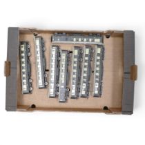 A collection of Hornby OO gauge Pullman carriages in cream and brown livery featuring third class