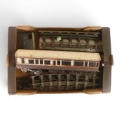 A quantity of gauge 1 track, together with long wooden passenger carriage in GWR livery, and freight