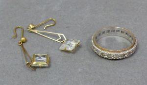 9ct gold eternity ring, size L/M,3.4g and pair yellow metal glass drop earrings, tested to be 9ct