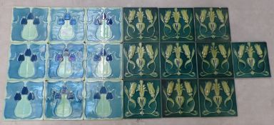 Collection of 19 Art Nouveau-period fireplace/wall/floor tiles: 9 of one design and 10 of the other,