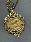 Queen Victoria 1889 gold full Sovereign in a 9ct mount on a 9ct chain, combined 19.4g.