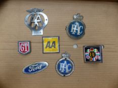 Group of 7 vintage car radiator badges (7).