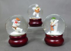 Three boxed small Coalport Characters The Snowman snow globes, The Hug, Dancing with Teddy and