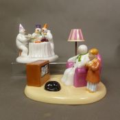 Two boxed Coalport Characters The Snowman figurines A Cold Night In and The Merry Trio (2).