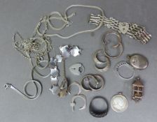 A collection of silver jewellery, including rings, necklaces, asian symbol bracelet, earrings,