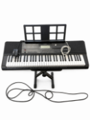 A Casio CT-X700 61 key portable arranger keyboard with touch sensitive keys and built-in music rest