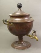 An antique copper and brass samovar on circular base with brass dispenser, overall height 38cm.