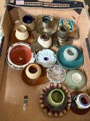 A collection of match strikers, including stoneware, glass, brass and ceramic examples, with further