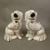 A pair of ceramic Staffordshire-style mantle dogs, H. 23cm. (2)