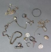 A collection of 925 silver jewellery to include rings, pendants, a brooch, bracelet, etc, combined