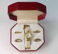 Peugeot gold plated watch with various detachable bezels, boxed and gold plated necklace.