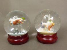 Two boxed Coalport Characters The Snowman snow/glitter globes, Treading the Boards and Walking in