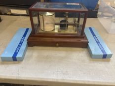 Casella, London barograph in mahogany display case, bevelled glass panels, flared base with built-in