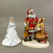 Two Royal Doulton made in Thailand figures, Father Christmas 2012 Christmas Joy HN5548 together with
