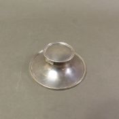 Sterling silver ink well, diameter 10cm, Birmingham 1920, weighted base, glass liner.