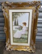 Framed oil on canvas depicting an Edwardian lady sat in a garden (Lady in Pink) by Italian artist