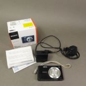 A Sony Cybershot DSC-W800 digital camera, with box, battery, charger, soft case and instructions.
