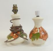 Moorcroft table lamps in the Hibiscus pattern on cream ground. (Tallest: 25cm to top of fitting) (