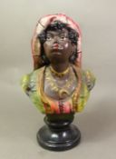 In the manner of Goldscheider, a Continental polychrome chalk ware bust of an African lady with