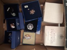 Swarovski boxed brooches x 4, with a pair of earrings and two Swarovski Collectors Club light