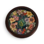 A Moorcroft Charger in the Carousel design by Rachel Bishop, in wooden surround, number 271,