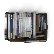 A collection of motorsport books including Autocourse Yearbooks, Nigel Mansell and Ayrton Senna.