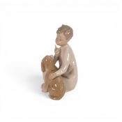 A Lladro figure 'Boy with Dog' model number 4522, height 19cm.