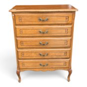 Continental light oak carved chest of 5 drawers, with brass handles and cabriole legs. (H: 86cm x W: