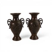A pair of Chinese Bronze Urn shaped vases, both decorated with embossed birds and flowers, height