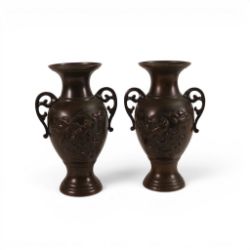 A pair of Chinese Bronze Urn shaped vases, both decorated with embossed birds and flowers, height