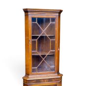 Tall free standing mahogany corner cupboard, with astragal glazed upper section and Dentil motif. (